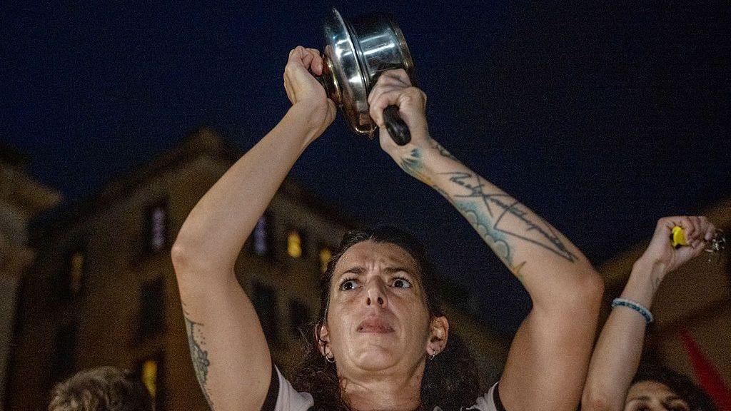 A women hits a saucepan during a housing protest at Sant Jaume Square on October 1, 2026 in Barcelona