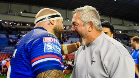 Wakefield's Jazz Tevaga and coach Daryl Powell celebrate after victory over Wigan.