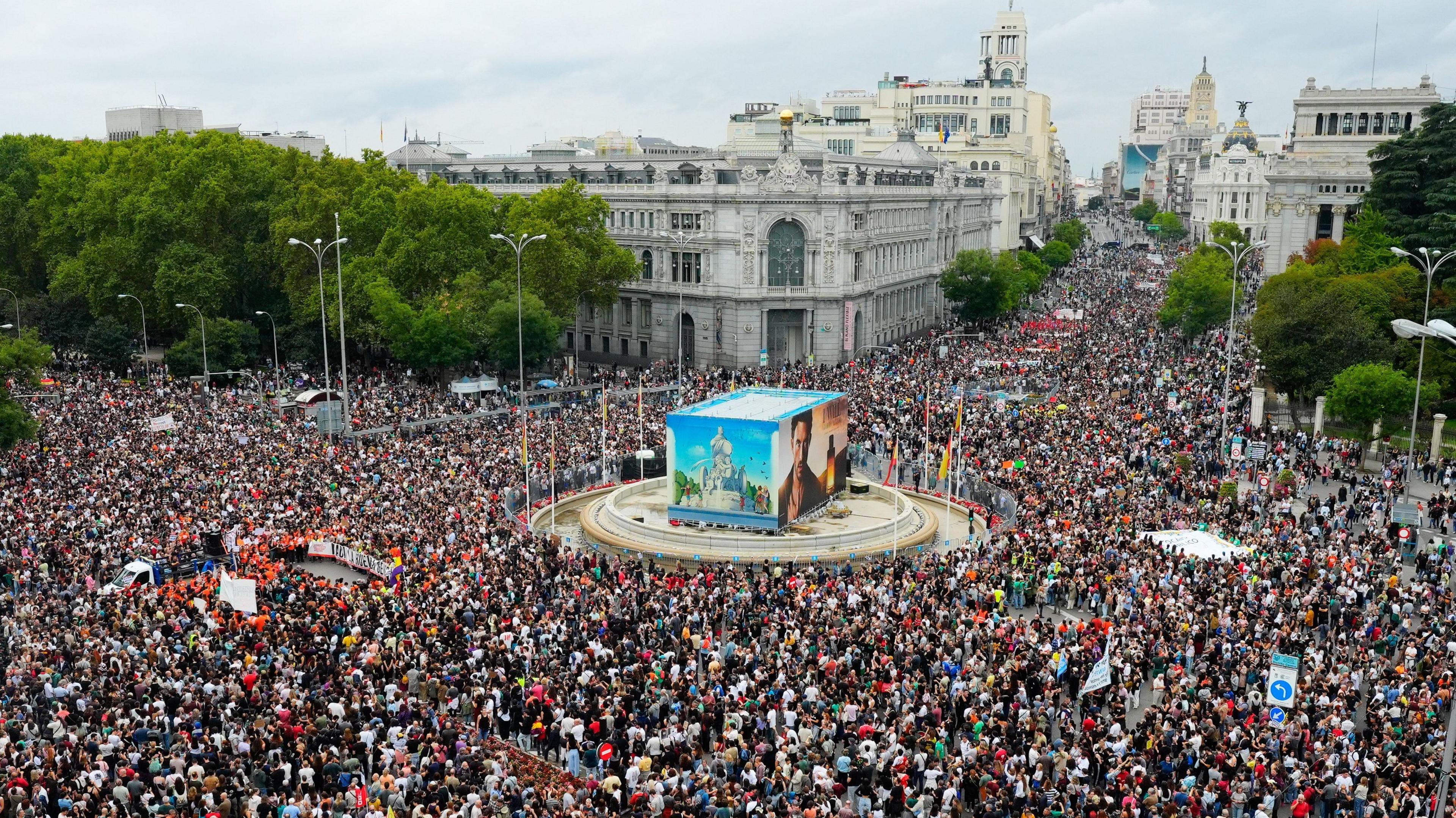 Tens of thousands of demonstrators taking to the streets in Madrid. An overhead shot shows a massive crowd of people gathered in the centre of the city with a huge area covered 