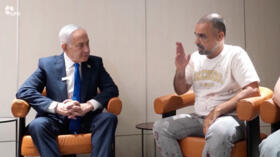 Israeli Prime Minister Benjamin Netanyahu meets Yaniv Hayun, a passenger on the FlyDubai flight bound for Israel from the United Arab Emirates