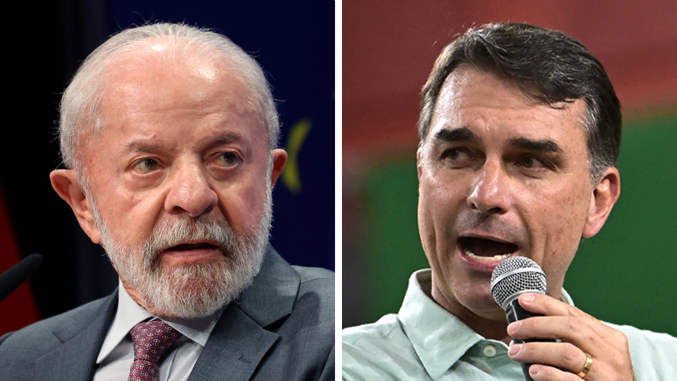 A composite image shows Luíz Inácio Lula da Silva, wearing a grey suit jacket and a burgundy tie, at the left,  and Flávio Bolsonaro, wearing a light green shirt but no tie, speaking into a microphone. 
