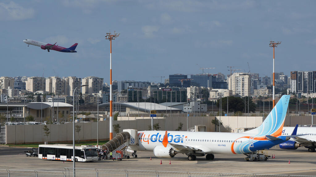 Passengers embark on a FlyDubai aircraft at Ben Gurion International Airport, near Tel Aviv, Israel, Wednesday, Sept. 30, 2026.