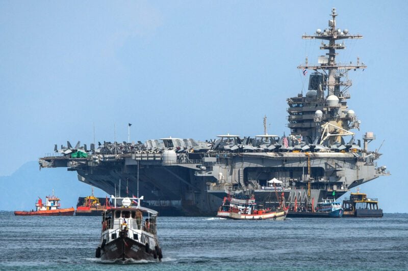USS George H.W. Bush arrives for retreat after supporting operations in Middle East, in Phuket