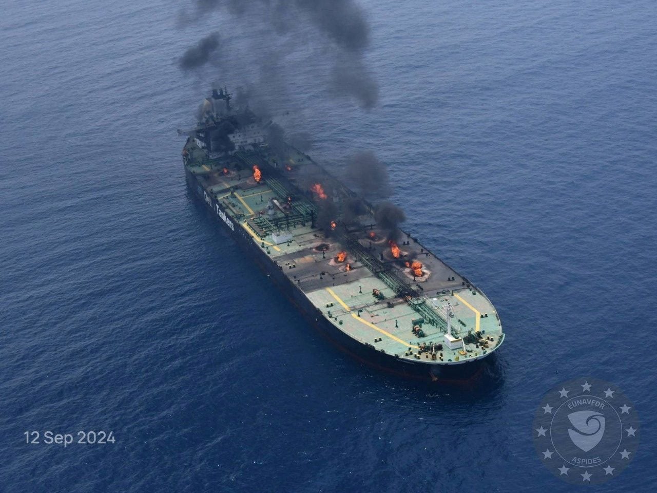 Flames and smoke rise from the Greek-flagged oil tanker Sounion