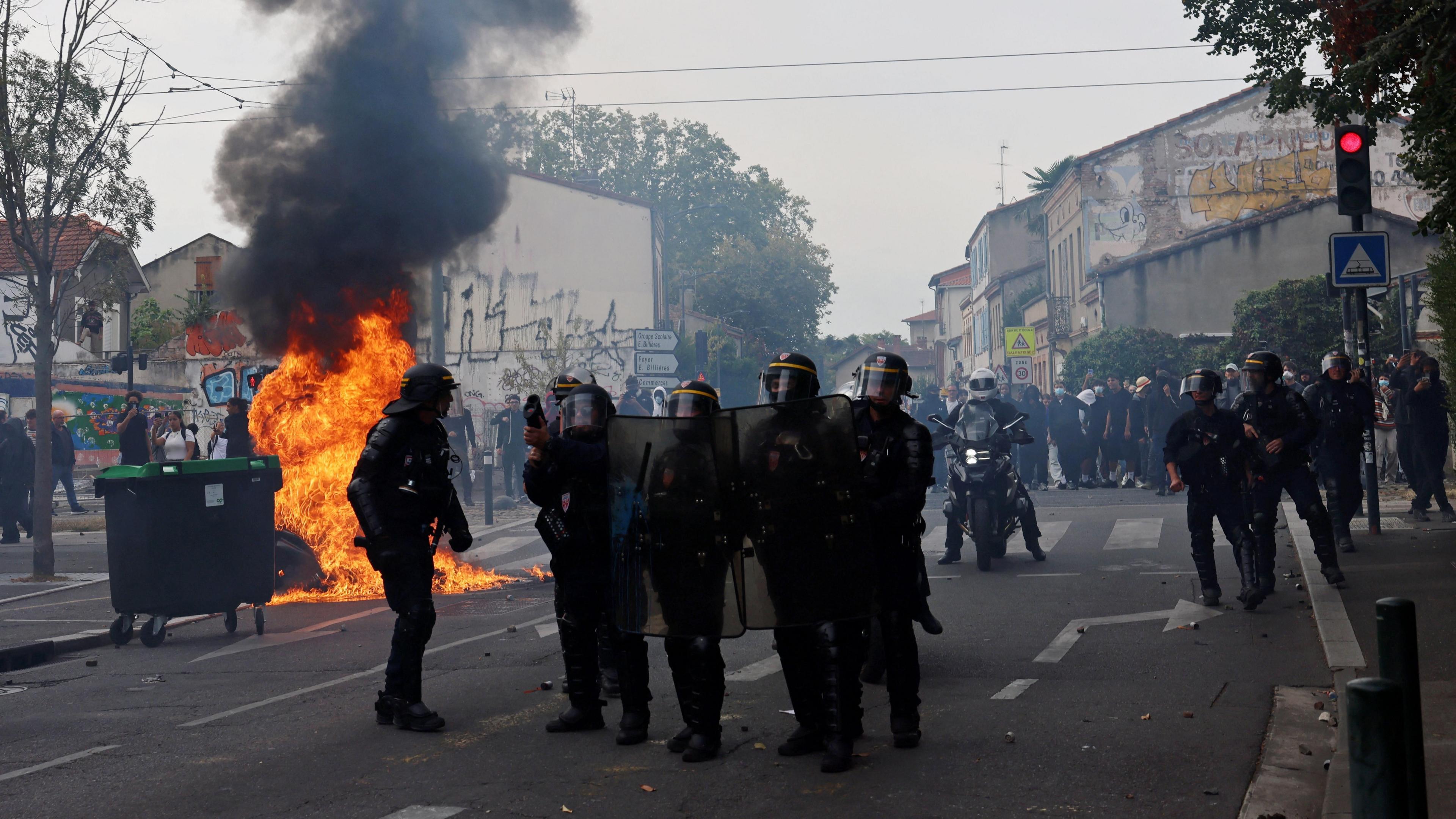 French CRS riot police stand in position amid clashes during a protest by high school students outside the Lycee Deodat-de-Severac high school as part of nationwide protests by high school students to demand the hiring of substitute teachers, increased resources and better learning conditions, in Toulouse as more than 400 schools remain closed following days of student protests that have escalated into violence in some places, France, October 2, 2026. 