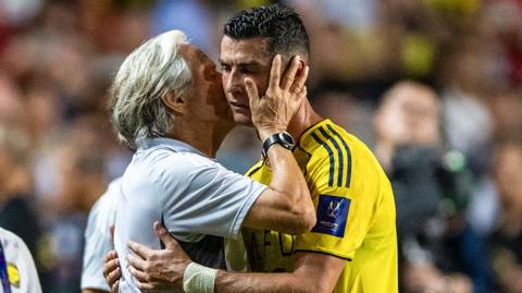 Portugal coach Jorge Jesus hugs Cristiano Ronaldo