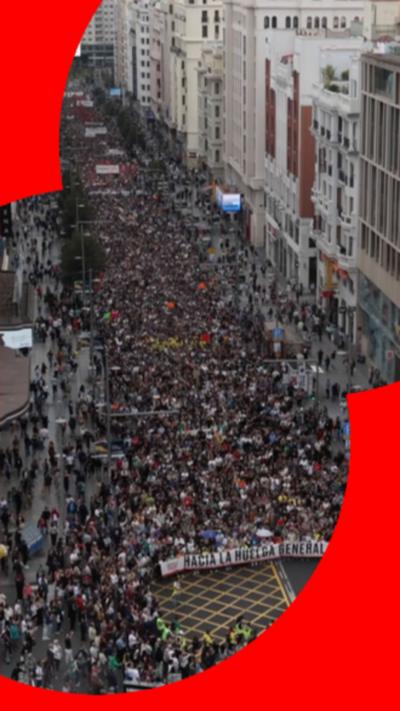 A large crowd fills the streets in protest in Spain.