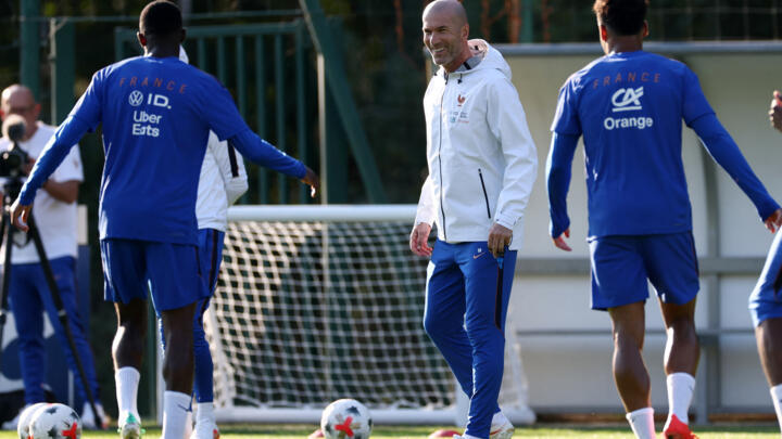 France's head coach Zinedine Zidane (C) plays with his players during a training session on the eve of France's UEFA Nations League football match against Belgium