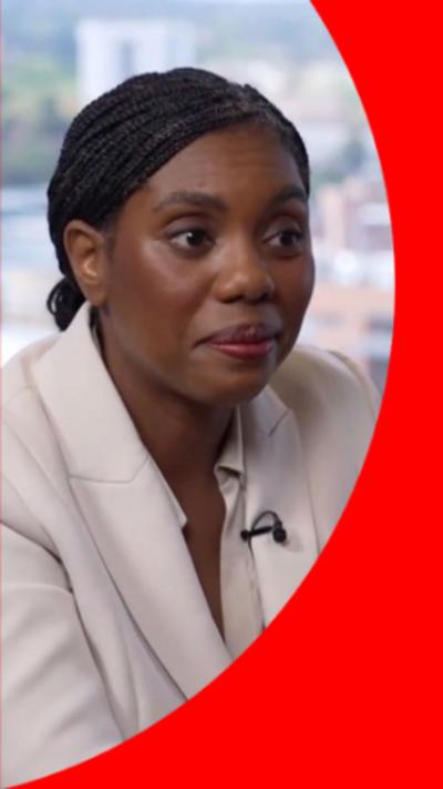 Kemi Badenoch in a white suit