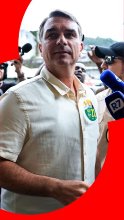 Flávio Bolsonaro has short dark hair and is wearing a bright yellow, short-sleeved shirt.