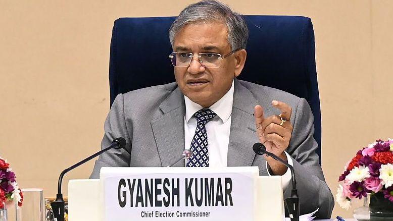 India's Chief Election Commissioner Gyanesh Kumar, wearing a grey suit, white shirt and a tie, addressing a press conference in October 2025, addressing the schedule of regional elections in Bihar state.