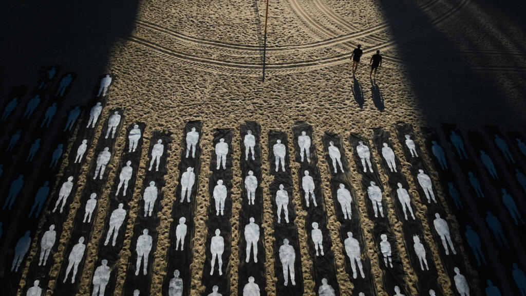 People walk past an installation marking the third anniversary of the October 7, 2023, Hamas attack on Israel, on the beachfront in Tel Aviv, Israel, on October 7, 2026