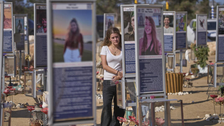 People visit the site of the Nova music festival near Kibbutz Reim, in southern Israel.