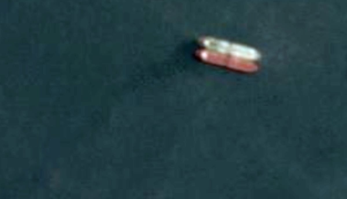 Satellite image captured by Planet Labs shows a ship-to-ship transfer of crude off the coast of Kuala Linggi, Malaysia, on April 16, 2020. Picture taken April 16, 2020. Planet Labs/Handout via REUTERS