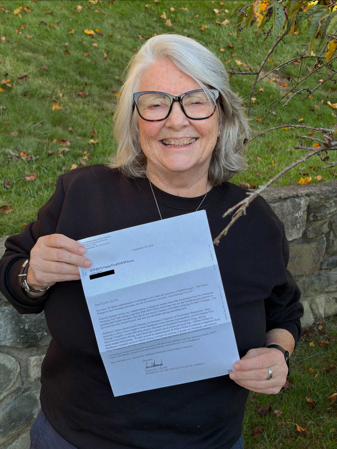 Ellen Allen holds the letter from President Donald Trump that explains the $500 payment she got. 