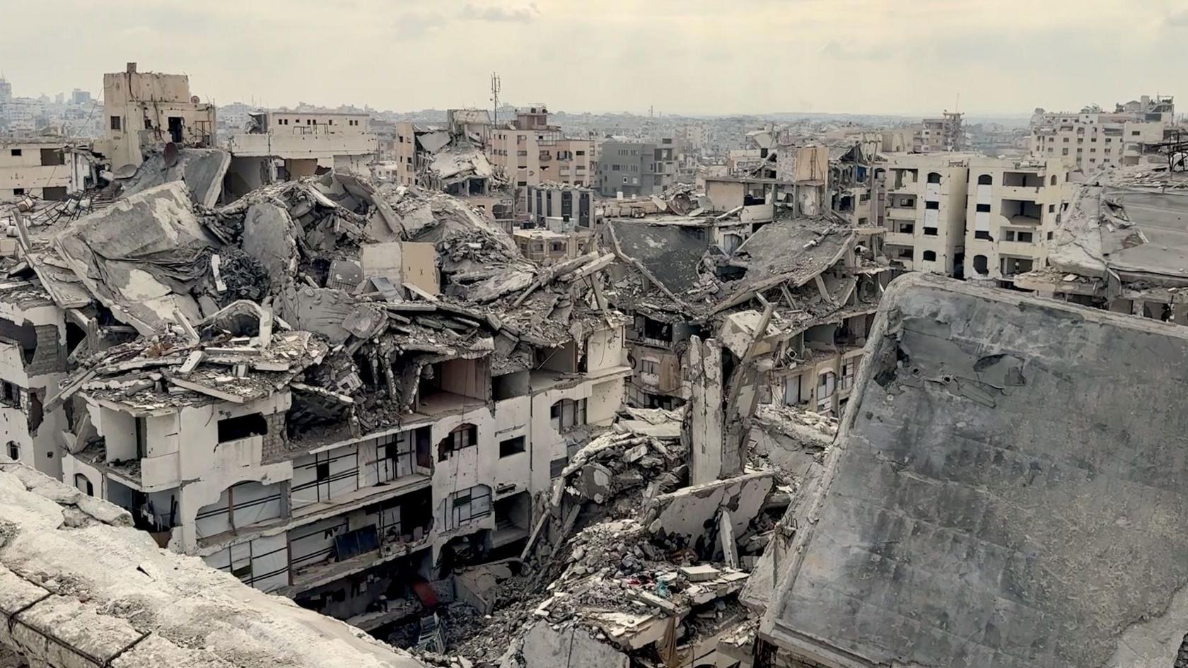 Aerial view of dozens of tall buildings destroyed in a Gaza city