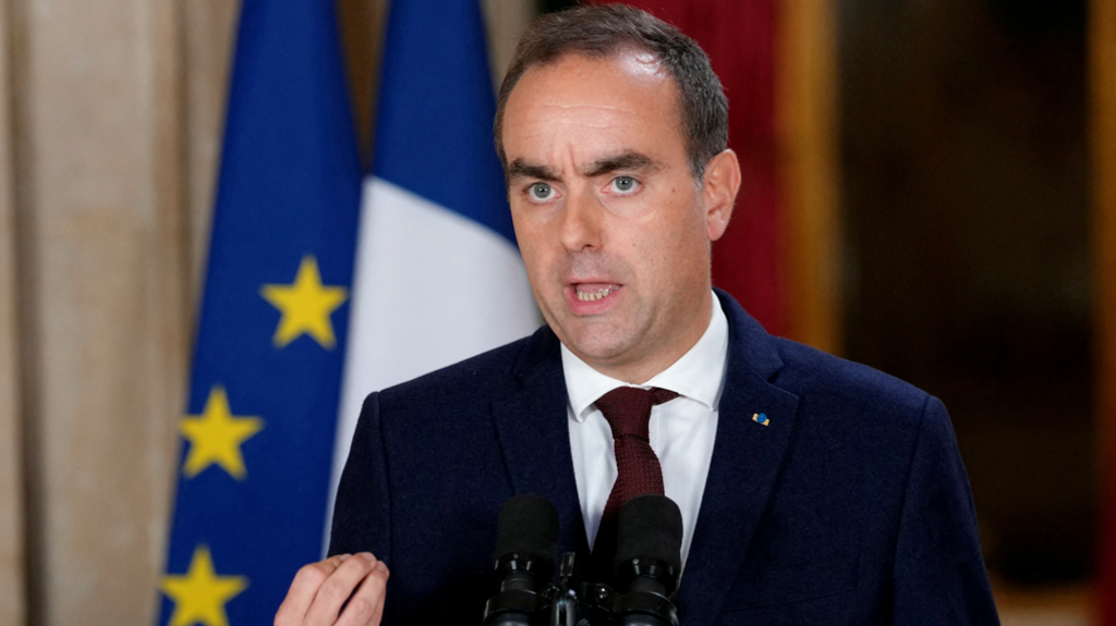 Prime Minister Sebastien Lecornu, wearing a dark suit and standing in front of French and EU flags, makes a statement in Paris, France, on 7 October 2026