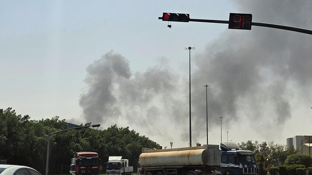 Vehicles travel along a road as black smoke billows from a fire at an oil facility in an industrial area in southern Riyadh, Saudi Arabia, Saturday, Oct. 3, 2026. 