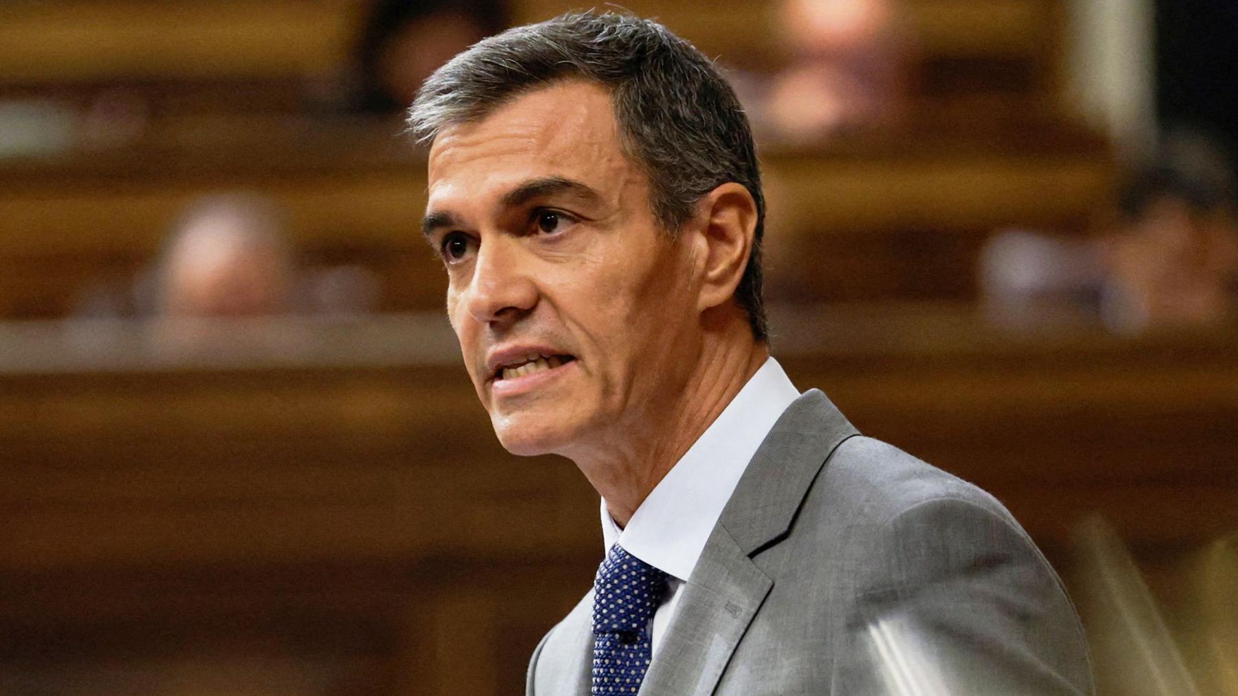 Spanish Prime Minister Pedro Sánchez, who has short grey hair and wears a grey suit and white shirt, speaks in parliament on 3 September.