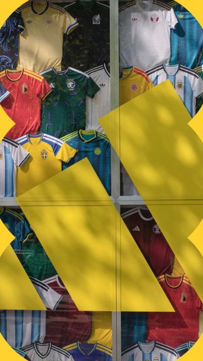A display case full of national soccer jerseys at an Adidas store that sells soccer jerseys.