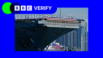 Sailor on board of the USS Abraham Lincoln as it pulls up to dock in San Diego