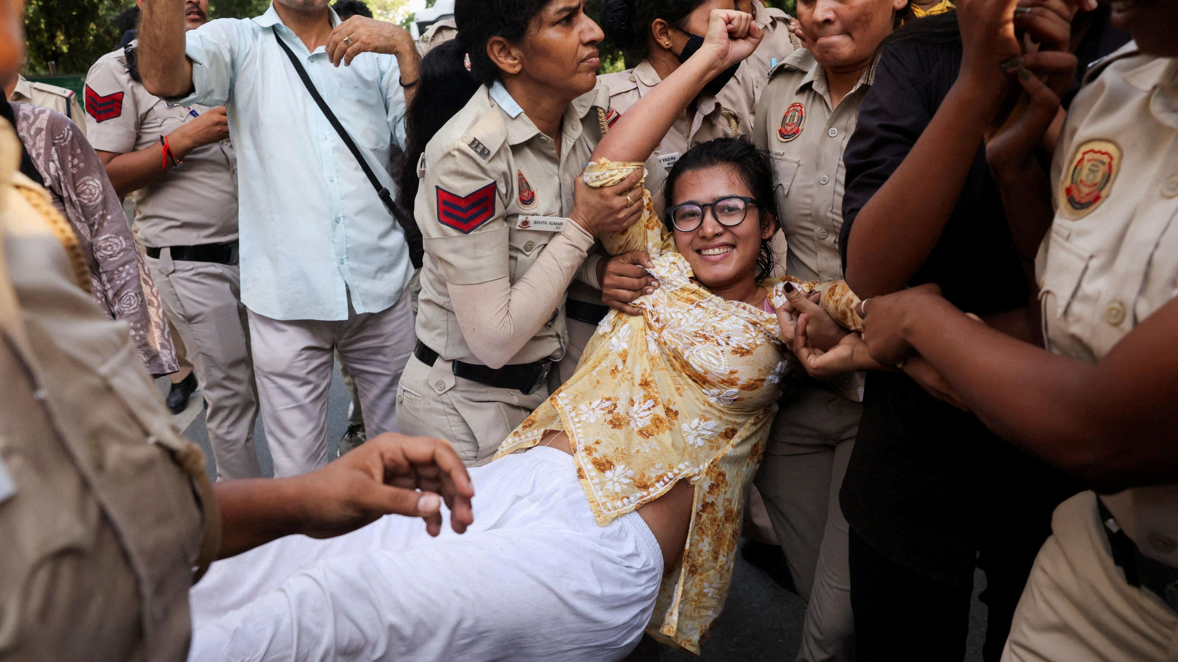 Neha Bora, National President of the All India Students' Association (AISA), reacts as she is detained by police during a protest against alleged assault on female protestors and journalists by Delhi Police and demanding resignation of chief election commissioner Gyanesh Kumar in New Delhi, India, October 4, 2026. REUTERS/Bhawika Chhabra