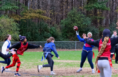 Flag football game with the quarterback about to throw the ball to the receiver