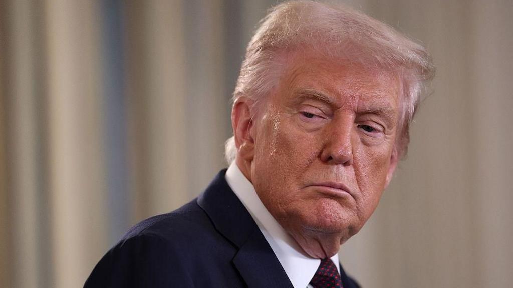 Donald Trump looks on as Israeli Prime Minister Benjamin Netanyahu delivers remarks during a joint news conference at the White House on 29 September