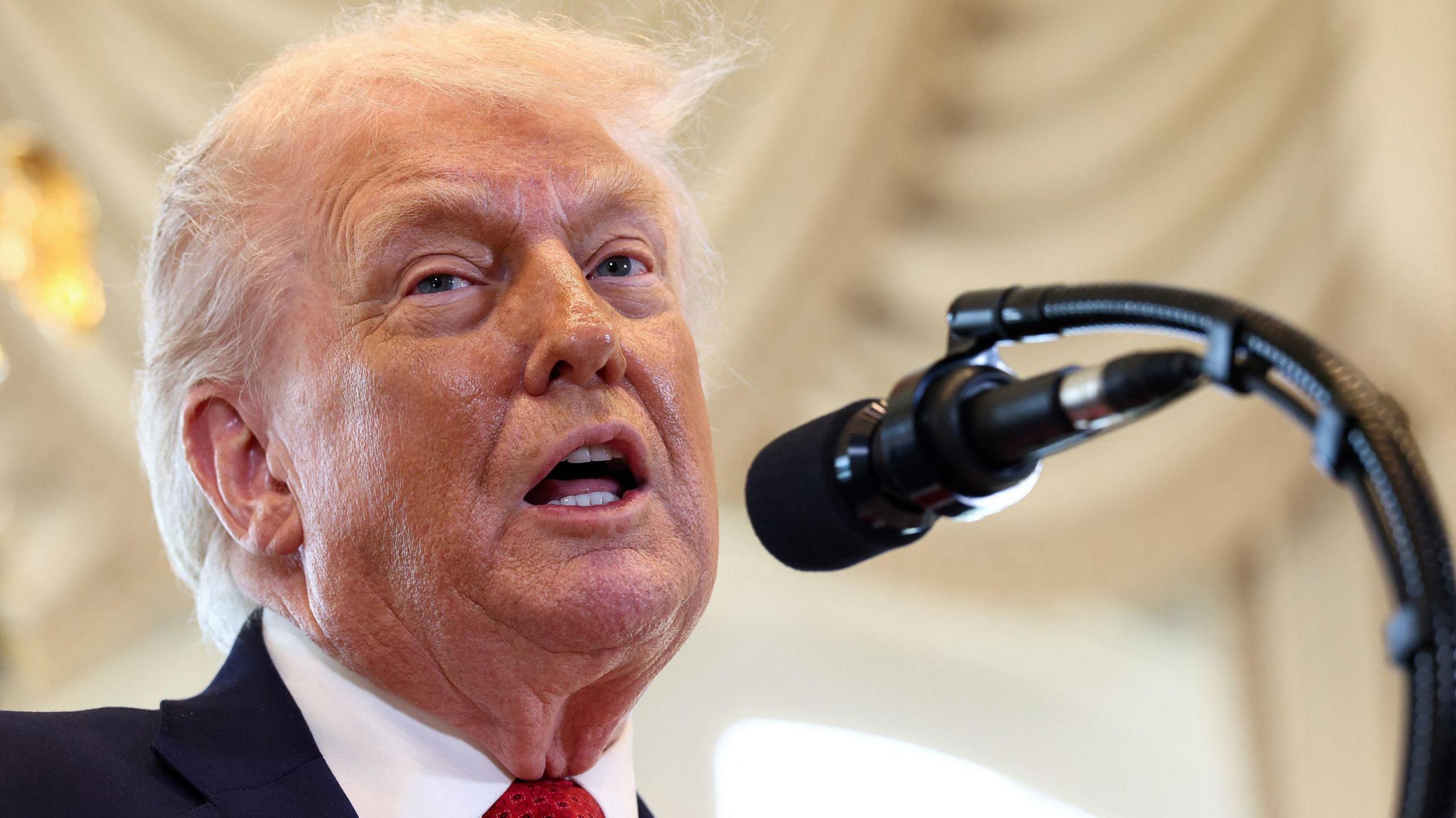 US President Donald Trump speaks at a ceremony held to dedicate a 4-mile stretch of road from West Palm Beach Airport to his Mar-a-Lago estate as 'President Donald J. Trump Boulevard', at the Mar-a-Lago estate in Palm Beach, Florida, U.S., January 16, 2026. 