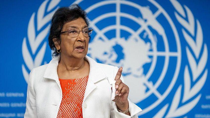 Navi Pillay, wearing an orange top and white jacket, points during press conference in Geneva on 16 September 2025.