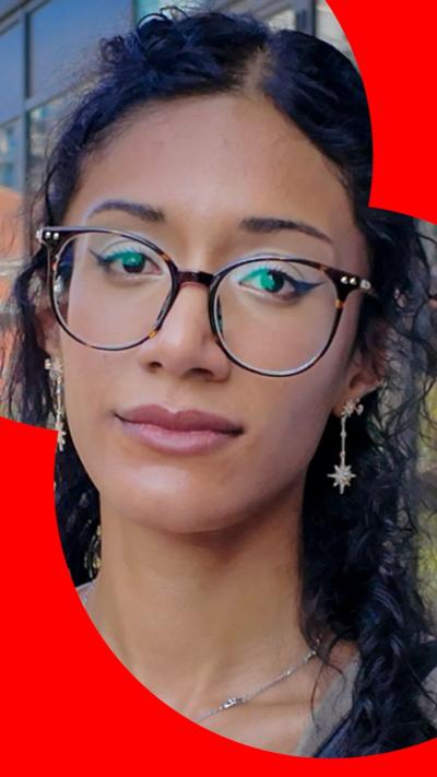 Woman with black hair wearing glasses 