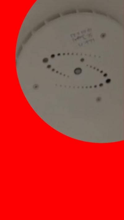 A tightly cropped image showing a vape detector in a secondary school.