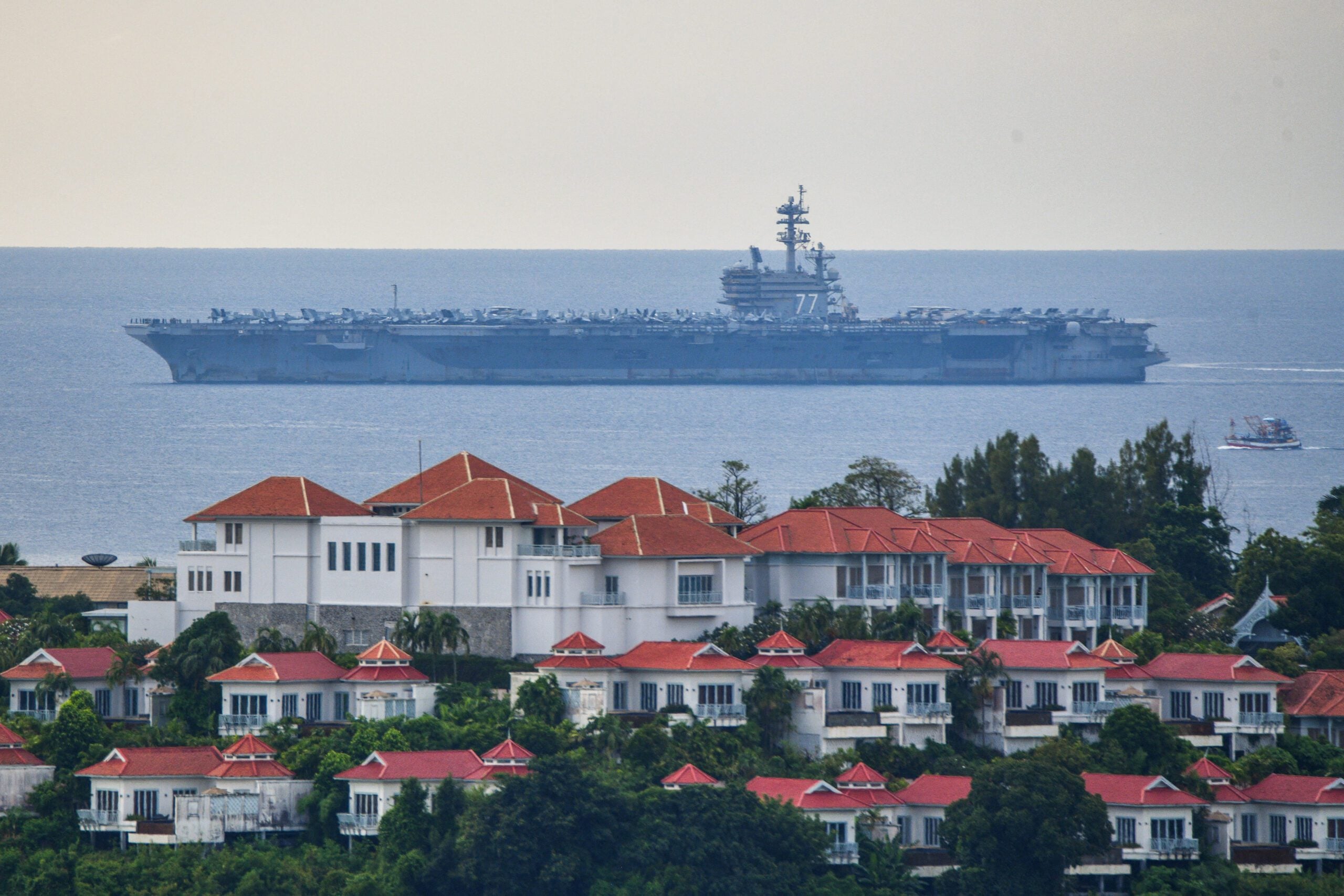 USS George H.W. Bush arrives for retreat after supporting operations in Middle East, in Phuket