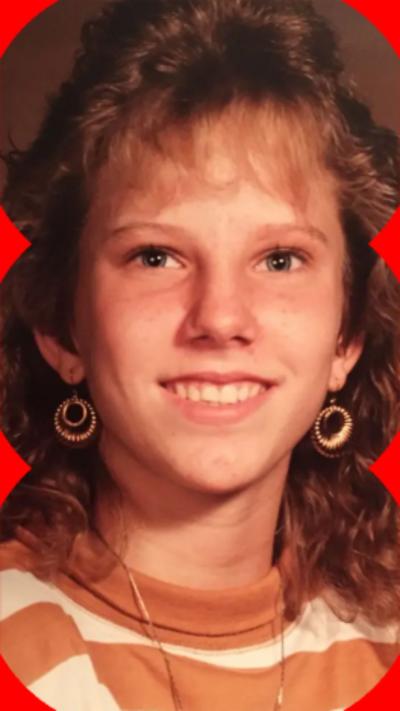 A photo of Colleen Slemmer with long blonde hair, wearing a striped brown and white top.