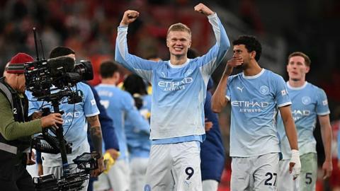 Manchester City players celebrate their win against Liverpool