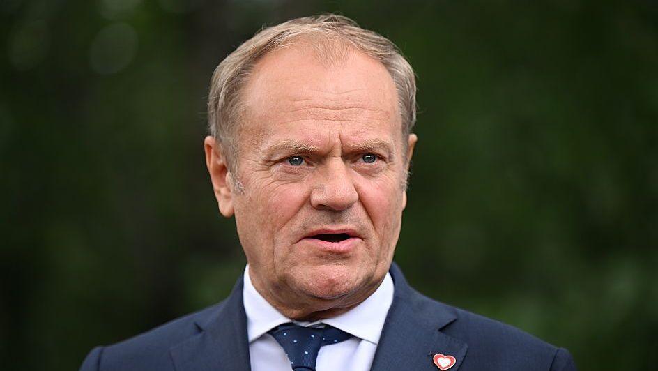Donald Tusk, who wears a suit and has thinning blonde hair, talks to the press in Tirana, Albania, last year.