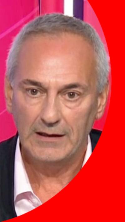 Daily Mirror journalist Kevin Maguire has short grey hair and is wearing a dark suit jacket and pink shirt.