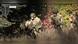 A screenshot shows men in battle gear emerging from a forest A screenshot shows men in battle gear emerging from a forest