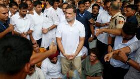 India's opposition leader Rahul Gandhi stands with hands tied as he participates in a sit-in protest outside Modi's residence in New Delhi on July 21, 2026