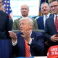 Trump speaks to reporters after signing a spending bill that ends a partial shutdown.