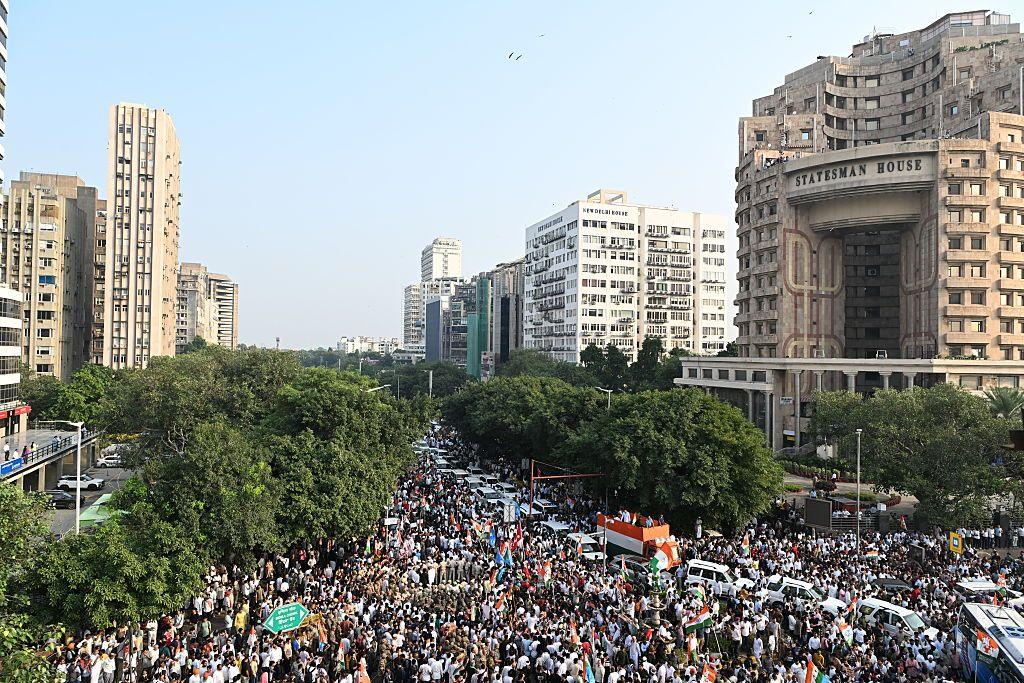 Protesters gather around a bus carrying Leader of the Opposition Rahul Gandhi during a demonstration on October 12, 2026 in New Delhi