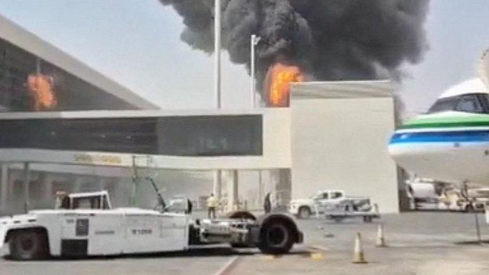 Flames and smoke can be seen from the outside of the airport after the missile struck