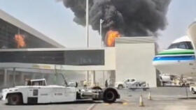 Smoke and flames rise from King Khalid Airport, after Yemen's Iran-aligned Houthis said they attacked the airport, in Riyadh, Saudi Arabia