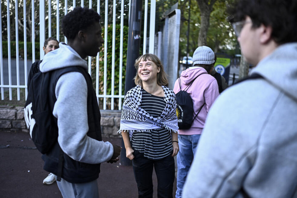 Swedish activist Greta Thunberg speaks with students as they prepare to take part in a blockade at the Lycee Paul Eluard in Saint-Denis, on the outskirts of Paris on October 13, 2026