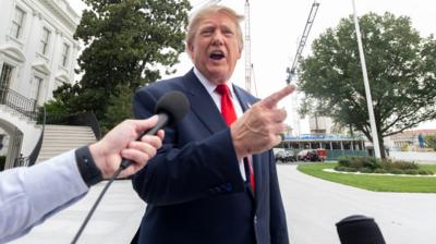 Donald Trump pointing and talking to reporters