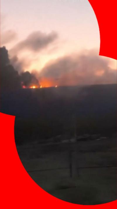 A still from a video of a data centre on fire following a Ukrainian strike, in a BBC Verify branded border.