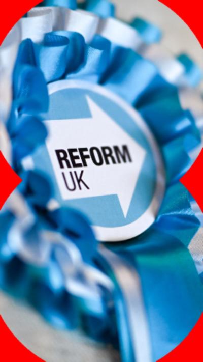 A blue Reform UK rosette on the lapel of a grey jacket.