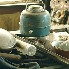 An old blue water jug with a lid