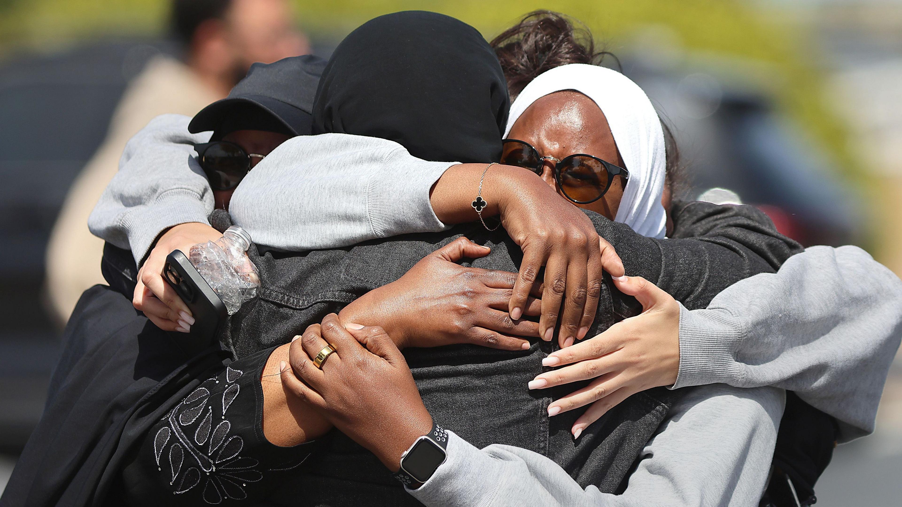 Members of the Muslim community in San Diego react after shooting at their mosque on 18 May 2026
