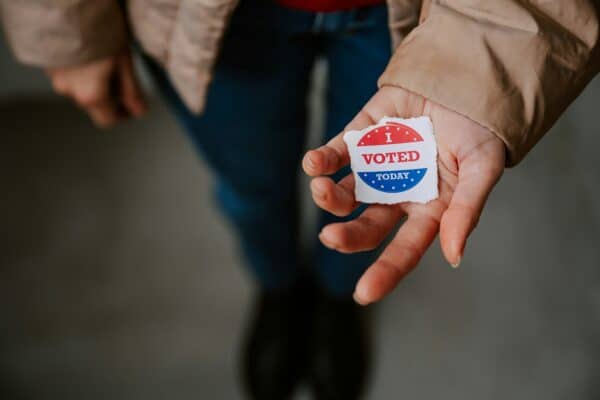 I Voted Today sticker in person's hand
